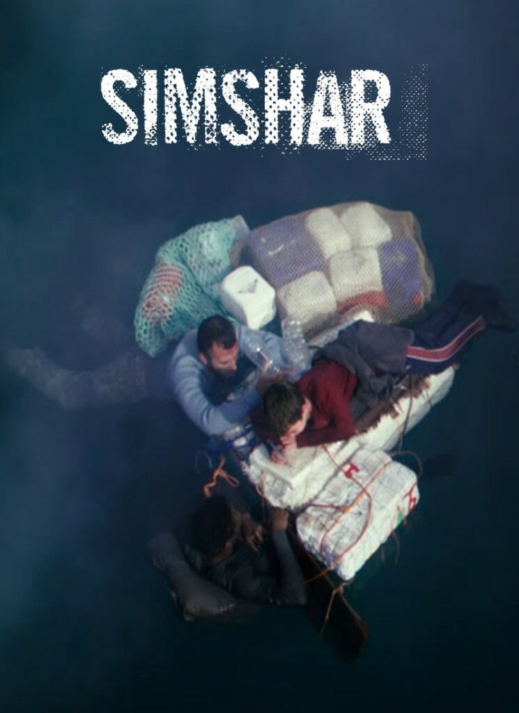 Two men and a young boy in the sea