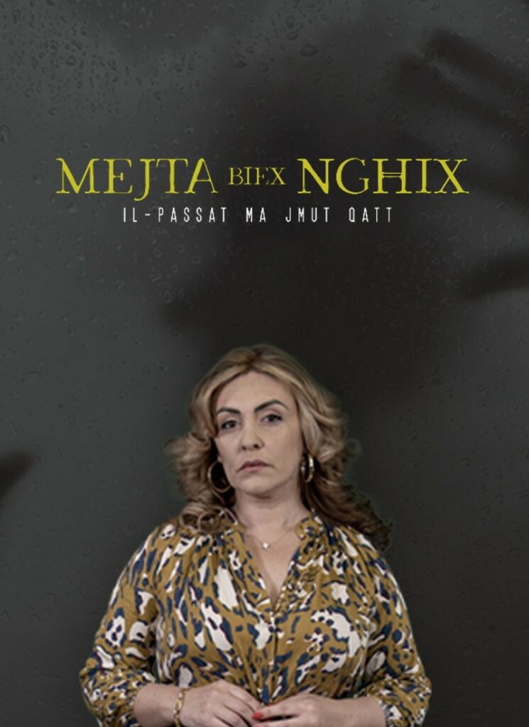 Older woman standing facing forward